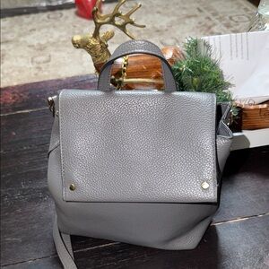 A New Day Mini Flap Convertible Backpack in gray faux leather.